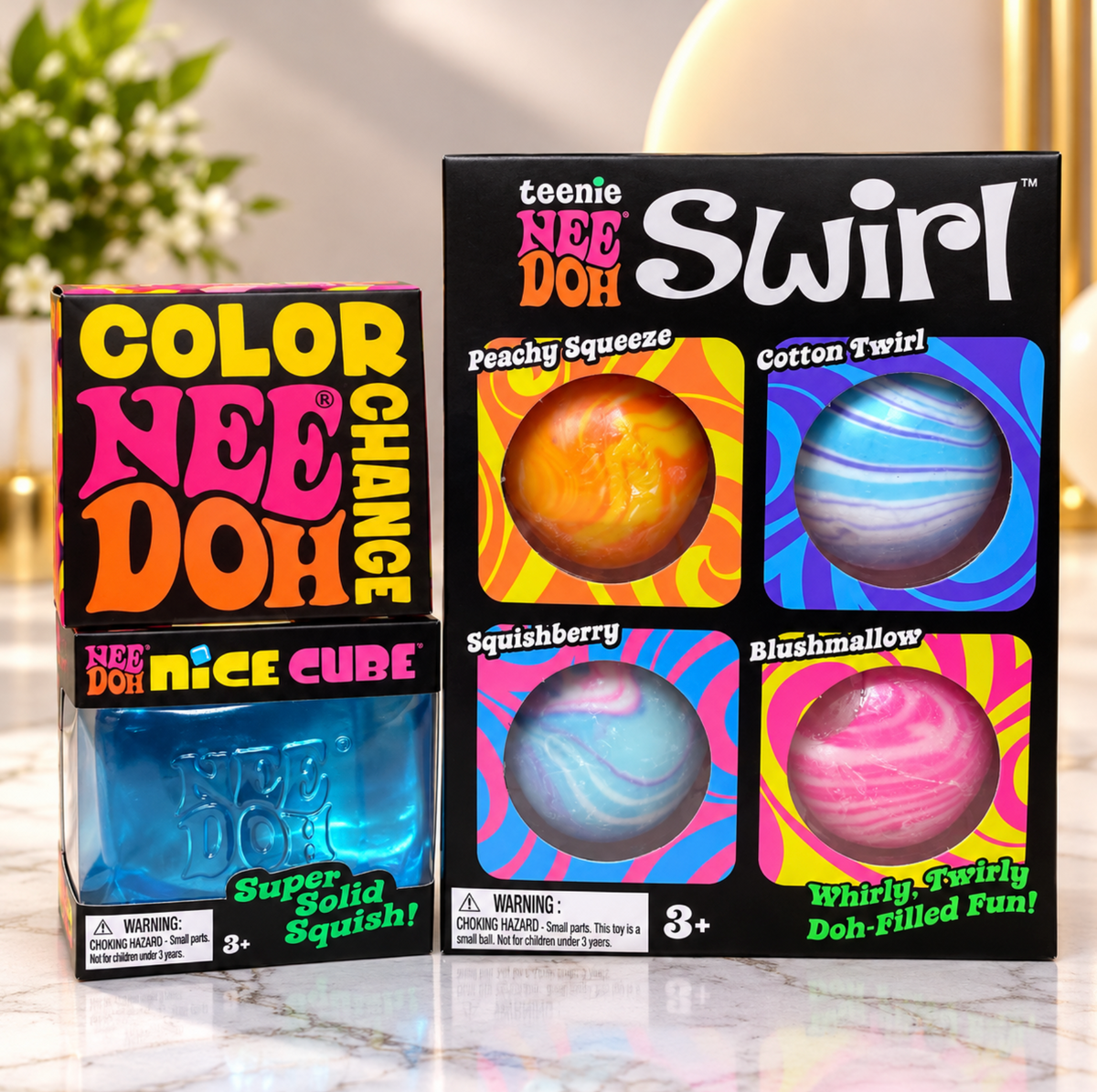NeeDoh bundle with one Teenie Swirl 4-pack, one blue Nice Cube and one boxed Color Change toy.