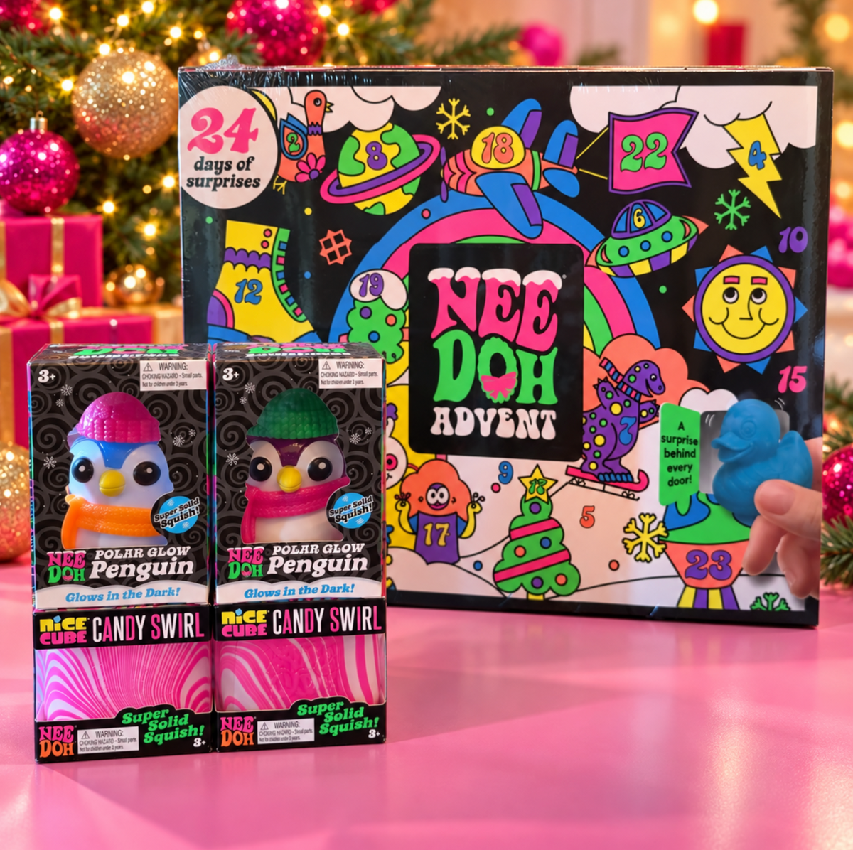 NeeDoh Christmas bundle featuring an Advent calendar, two Polar Glow Penguins and two pink Nice Cube Candy Swirl squishies.